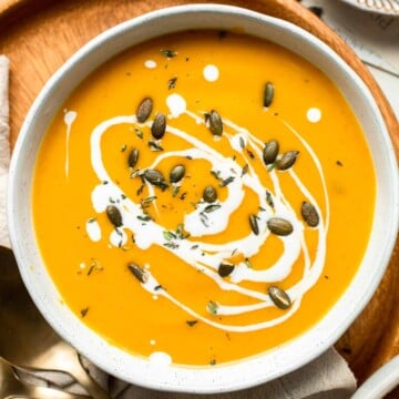 Curried Butternut Squash Soup is rich, creamy, and brimming with cozy fall flavors. Best of all, it'll be on the table in just over 30 minutes! | aheadofthyme.com
