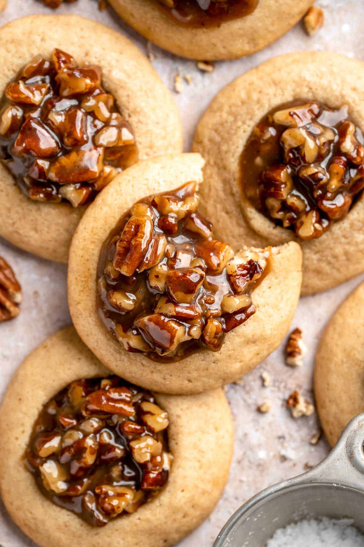 Pecan Pie Cookies have a buttery, chewy cookie base with a dollop of homemade pecan pie filling in the center of each one. They taste just like the classic! | aheadofthyme.com