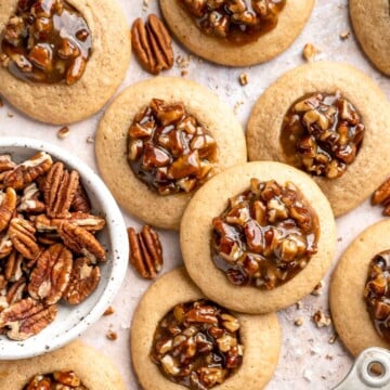 Pecan Pie Cookies have a buttery, chewy cookie base with a dollop of homemade pecan pie filling in the center of each one. They taste just like the classic! | aheadofthyme.com