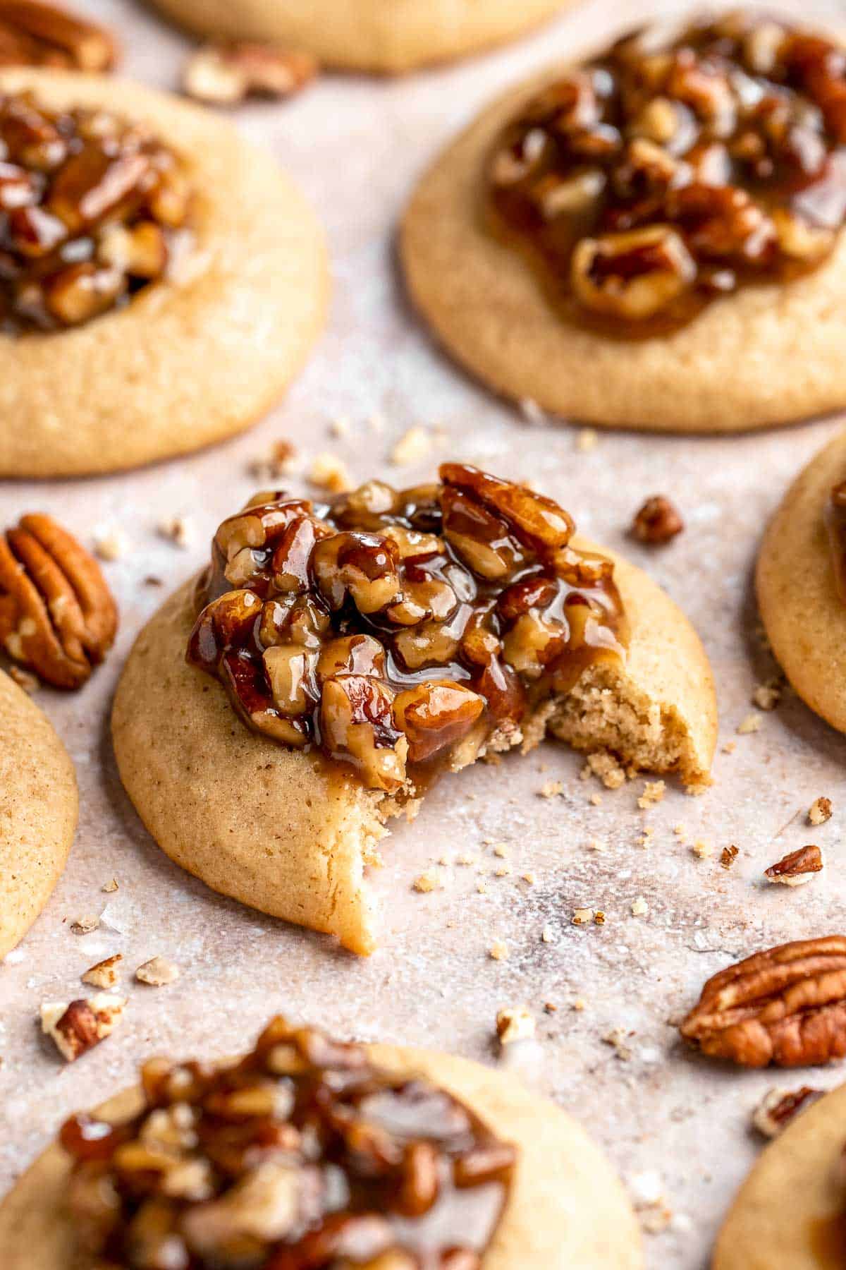 Pecan Pie Cookies have a buttery, chewy cookie base with a dollop of homemade pecan pie filling in the center of each one. They taste just like the classic! | aheadofthyme.com