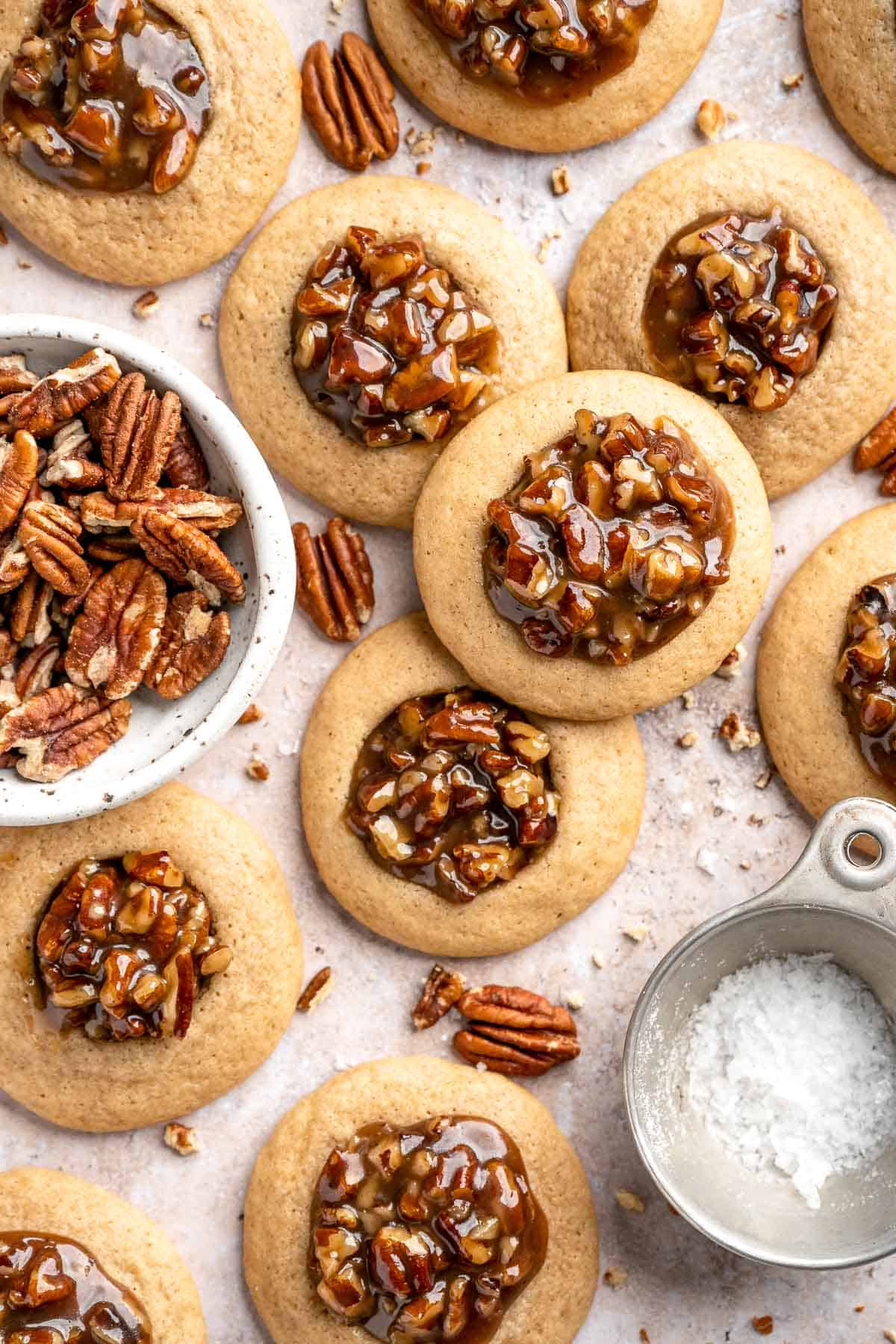 Pecan Pie Cookies have a buttery, chewy cookie base with a dollop of homemade pecan pie filling in the center of each one. They taste just like the classic! | aheadofthyme.com