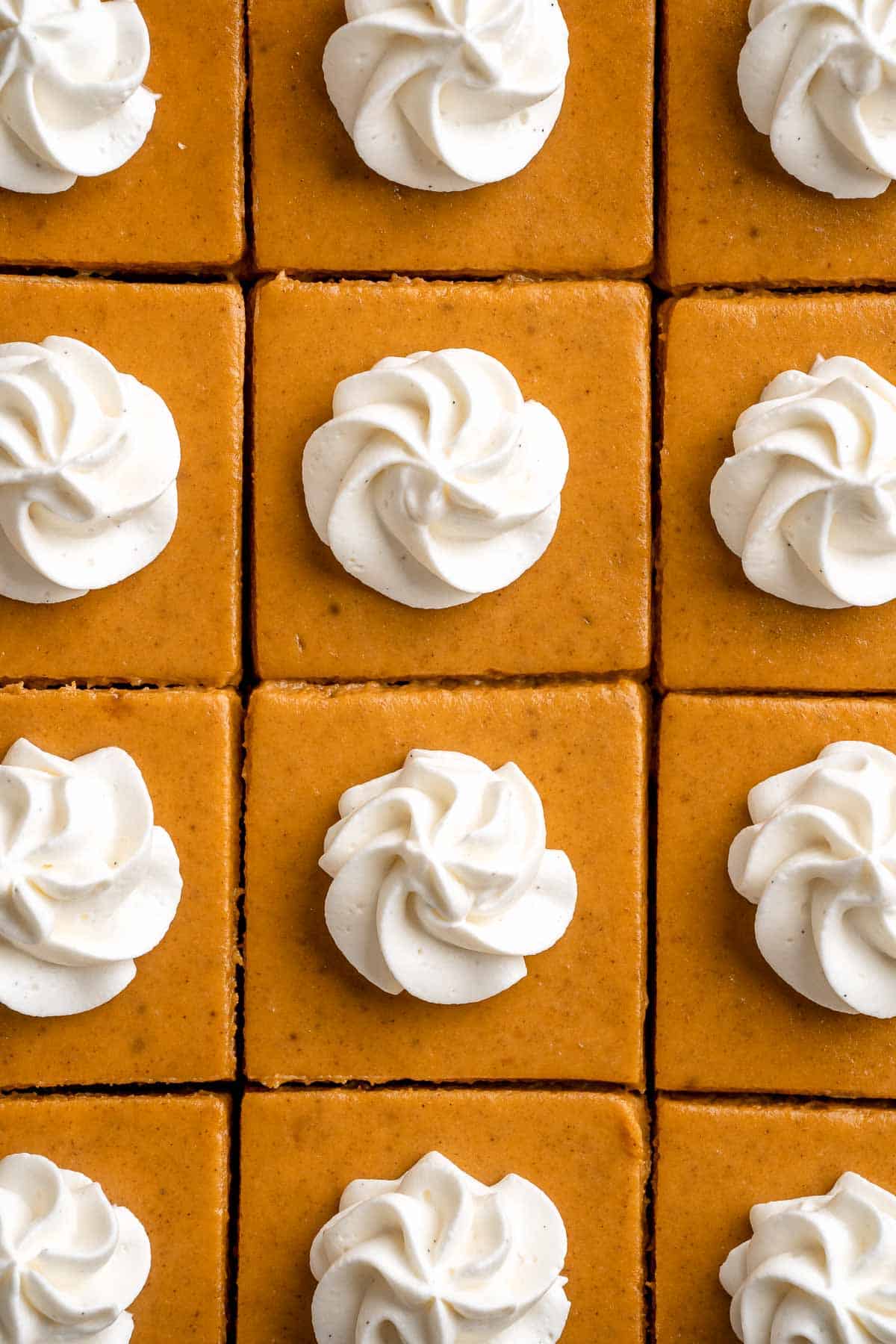 With a buttery shortbread crust and velvety pumpkin filling, these Pumpkin Pie Bars make it easy to traditional pumpkin pie in handheld form! | aheadofthyme.com