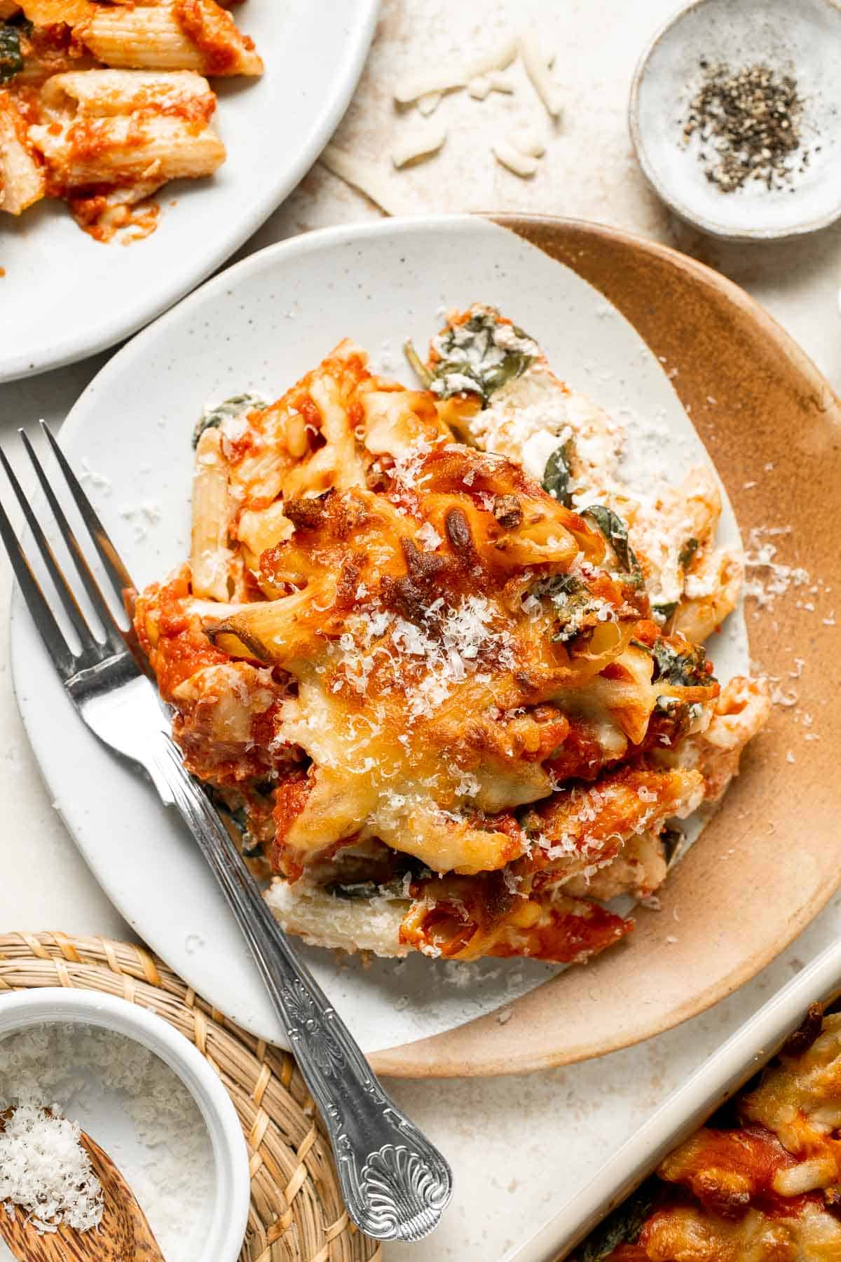 Spinach and Ricotta Pasta Bake is the ultimate cozy comfort meal, packed with creamy ricotta and tender spinach, tossed in marinara, and baked until bubbly. | aheadofthyme.com