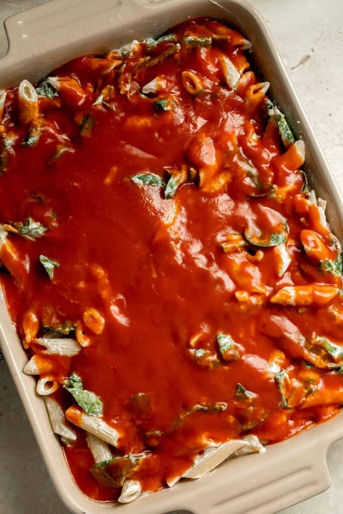 Spinach and Ricotta Pasta Bake is the ultimate cozy comfort meal, packed with creamy ricotta and tender spinach, tossed in marinara, and baked until bubbly. | aheadofthyme.com