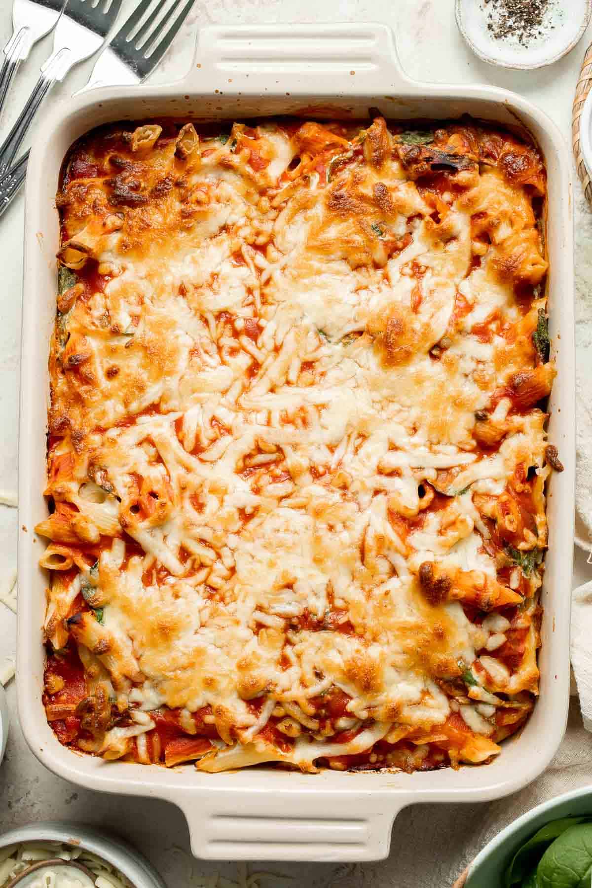 Spinach and Ricotta Pasta Bake is the ultimate cozy comfort meal, packed with creamy ricotta and tender spinach, tossed in marinara, and baked until bubbly. | aheadofthyme.com