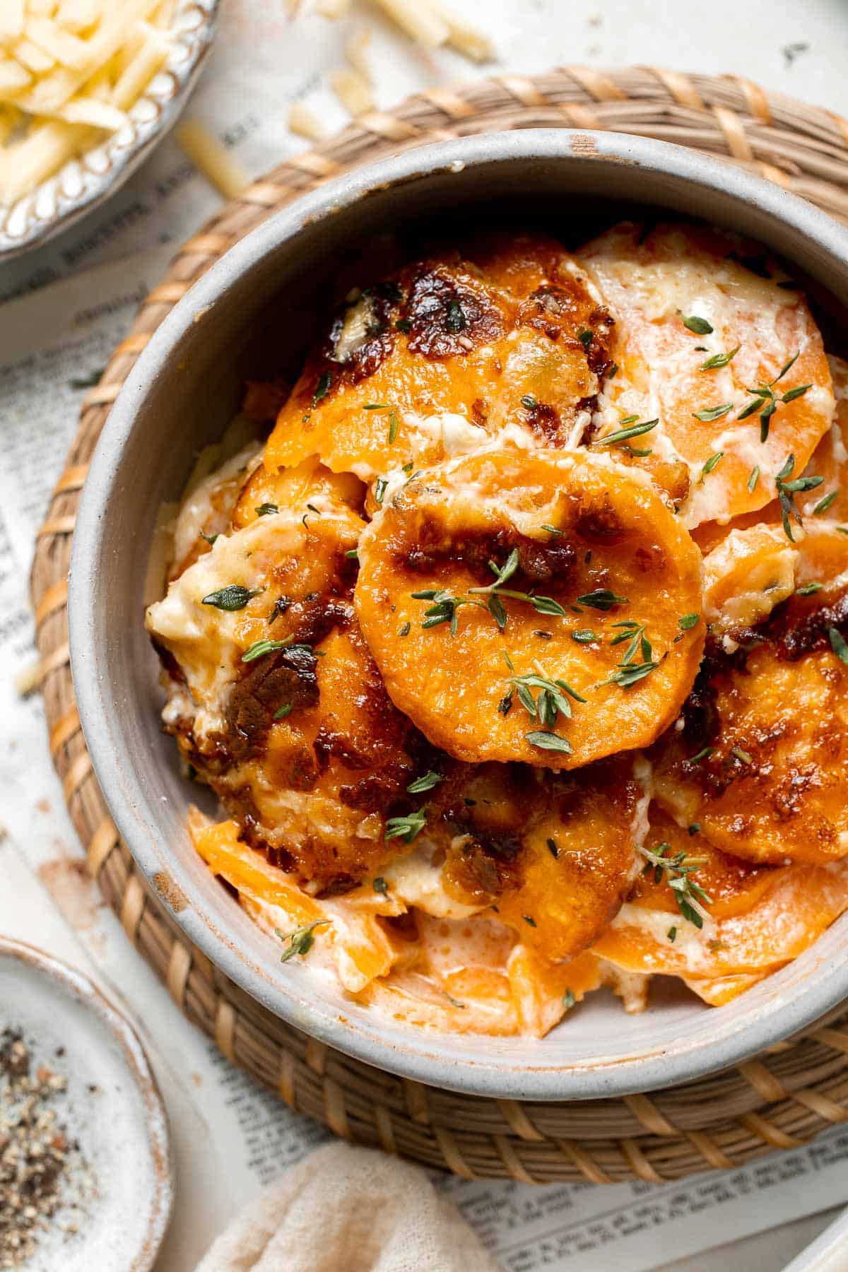 Made with thinly sliced sweet potatoes baked in a creamy béchamel sauce, this Sweet Potato Gratin is the most luxurious way to serve sweet potatoes. | aheadofthyme.com