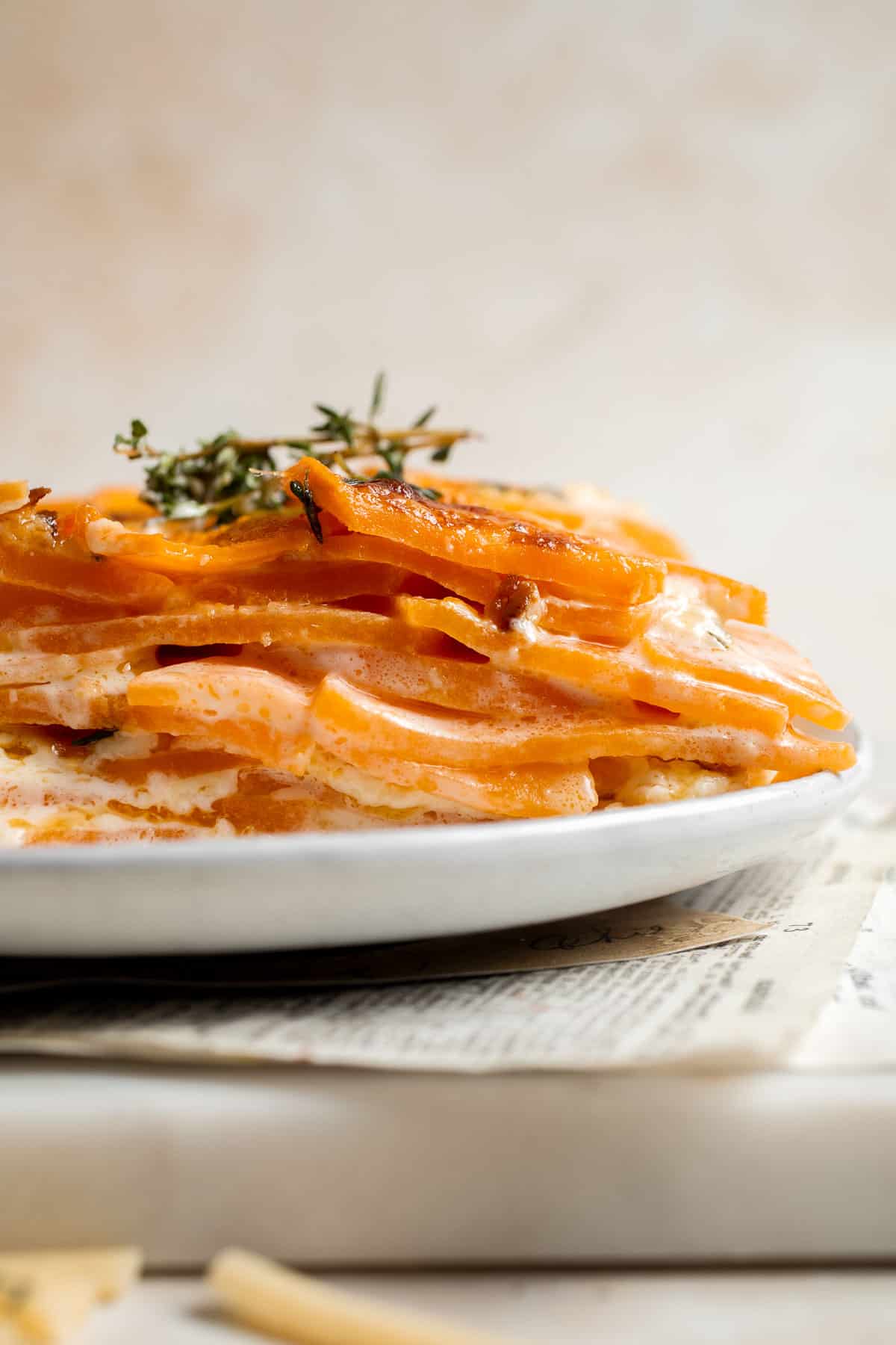 Made with thinly sliced sweet potatoes baked in a creamy béchamel sauce, this Sweet Potato Gratin is the most luxurious way to serve sweet potatoes. | aheadofthyme.com