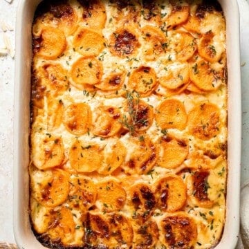 Made with thinly sliced sweet potatoes baked in a creamy béchamel sauce, this Sweet Potato Gratin is the most luxurious way to serve sweet potatoes. | aheadofthyme.com
