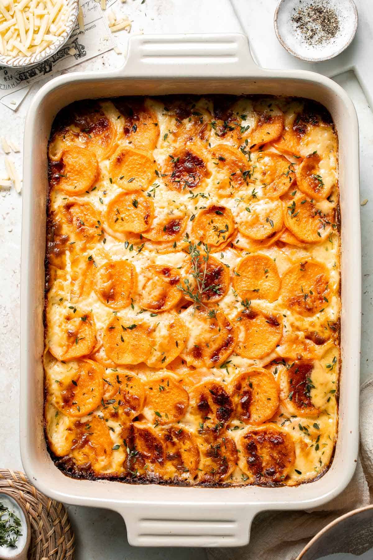 Made with thinly sliced sweet potatoes baked in a creamy béchamel sauce, this Sweet Potato Gratin is the most luxurious way to serve sweet potatoes. | aheadofthyme.com
