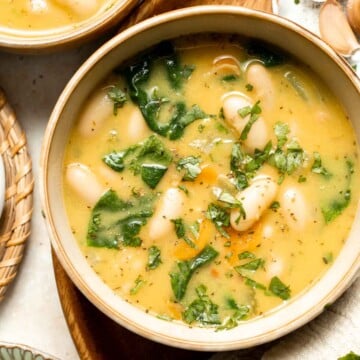 This Tuscan White Bean Soup is comforting, nourishing, and delicious, packed with creamy cannellini beans, fresh veggies, and herbs. Ready in 30 minutes! | aheadofthyme.com