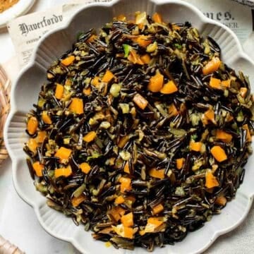Wild Rice Pilaf is a wholesome, nutritious side dish that pairs the naturally nutty flavor of wild rice with vegetables, spices, and fresh herbs. | aheadofthyme.com