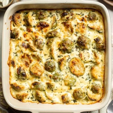 Made with tender, roasted Brussels sprouts baked in a rich, creamy cheese sauce, this Brussels Sprouts Gratin is the ultimate fall comfort food. | aheadofthyme.com