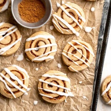Cinnamon Roll Cookies are soft and buttery slice-and-bake cookie with a cinnamon-sugar swirl, sweet icing, and the cozy flavors of classic cinnamon rolls. | aheadofthyme.com