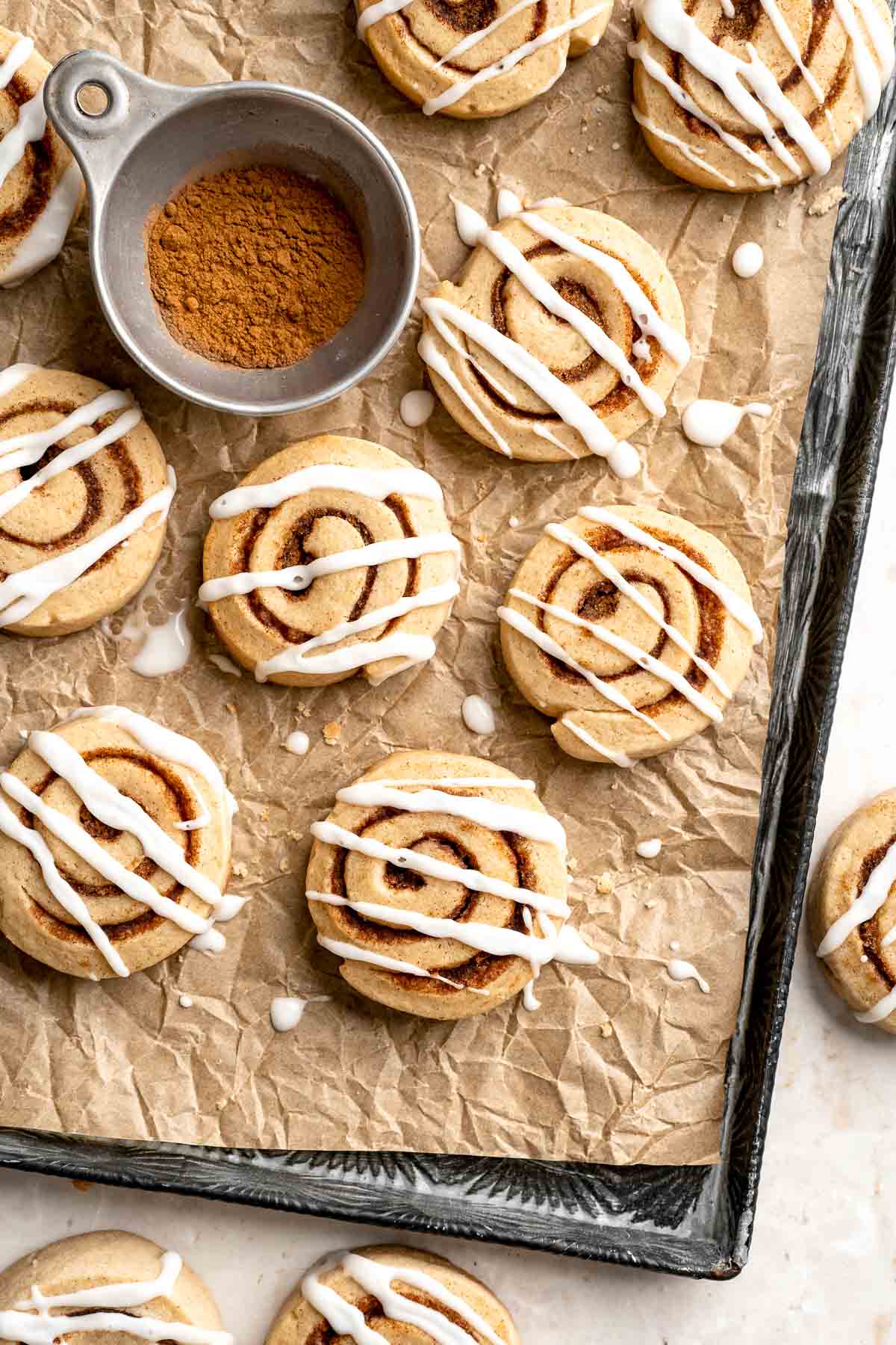 Cinnamon Roll Cookies are soft and buttery slice-and-bake cookie with a cinnamon-sugar swirl, sweet icing, and the cozy flavors of classic cinnamon rolls. | aheadofthyme.com