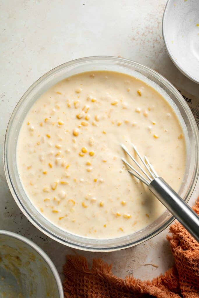 Creamy Corn Pudding transforms simple pantry staples into a luscious pudding packed with flavor. Serve this traditional Southern side dish for Thanksgiving. | aheadofthyme.com