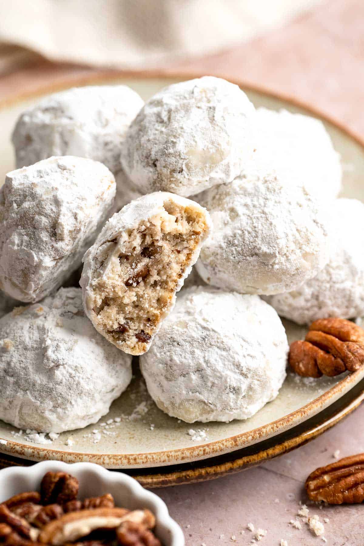 Mexican Wedding Cookies are a classic treat known for their snow-white powdered sugar coating and pecan-studded shortbread that melts in your mouth. | aheadofthyme.com