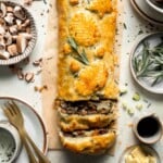 Mushroom Wellington is a vegetarian entree filled with mushrooms, vegetables, fresh herbs, and pecans, wrapped in flaky puff pastry and baked until golden. | aheadofthyme.com