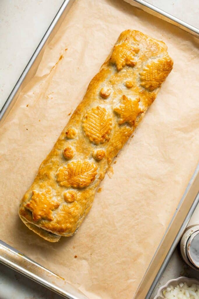 Mushroom Wellington is a vegetarian entree filled with mushrooms, vegetables, fresh herbs, and pecans, wrapped in flaky puff pastry and baked until golden. | aheadofthyme.com