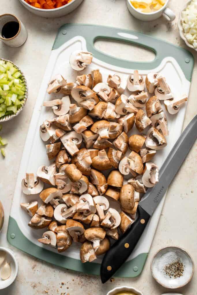 Mushroom Wellington is a vegetarian entree filled with mushrooms, vegetables, fresh herbs, and pecans, wrapped in flaky puff pastry and baked until golden. | aheadofthyme.com