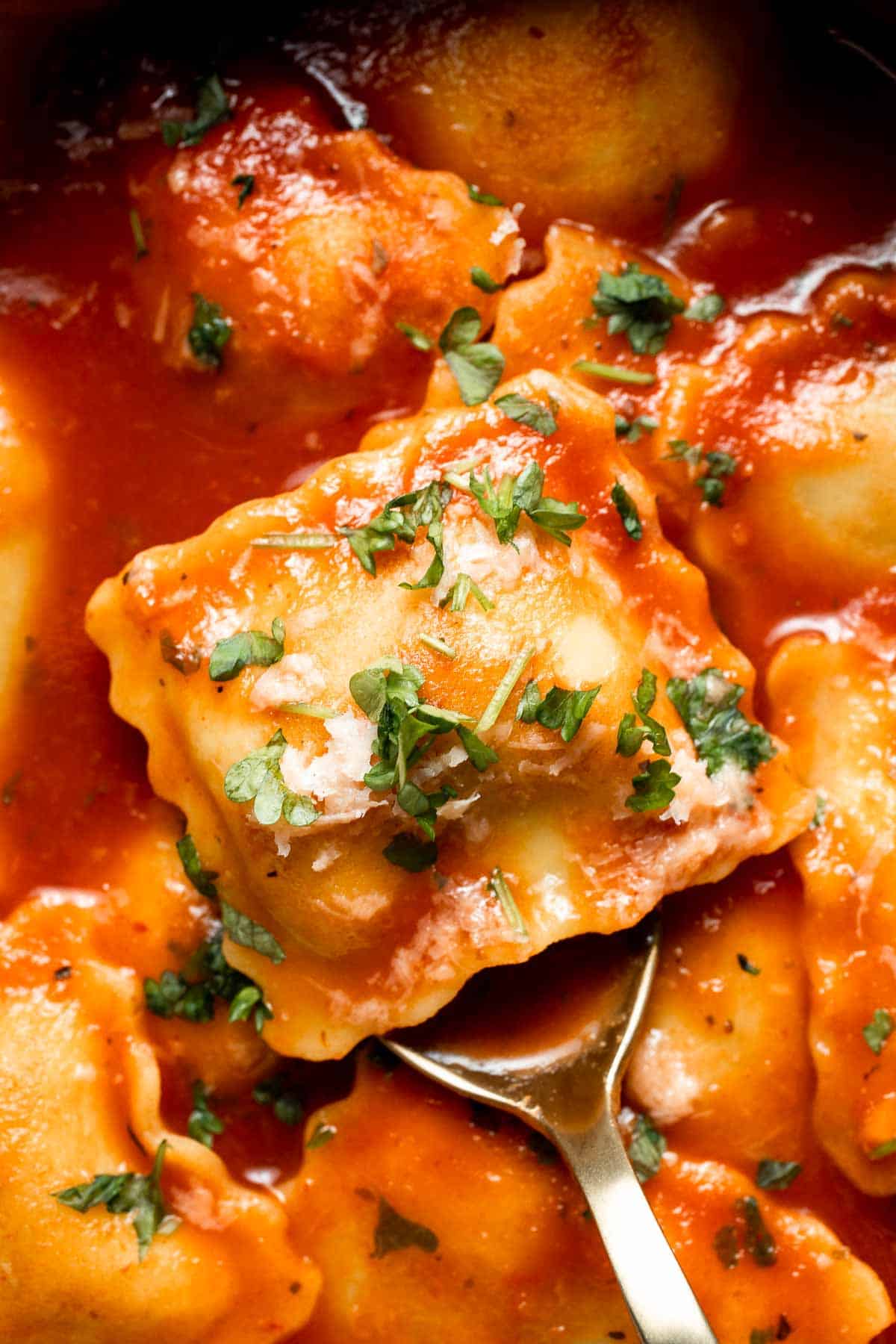 This simple Ravioli Soup is a quick, cozy meal with plump pillows of ravioli simmered in a hearty homemade tomato soup. Ready in just 20 minutes! | aheadofthyme.com