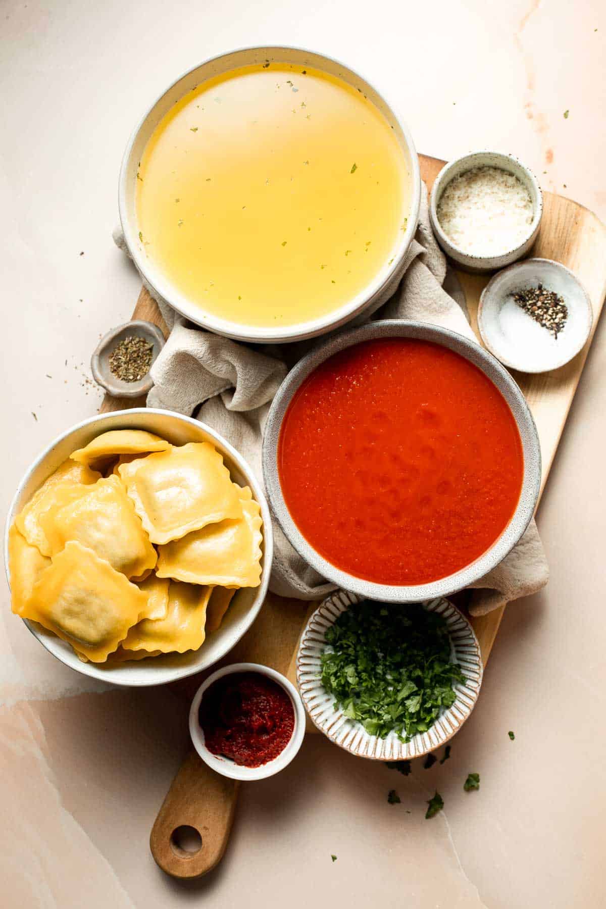 This simple Ravioli Soup is a quick, cozy meal with plump pillows of ravioli simmered in a hearty homemade tomato soup. Ready in just 20 minutes! | aheadofthyme.com
