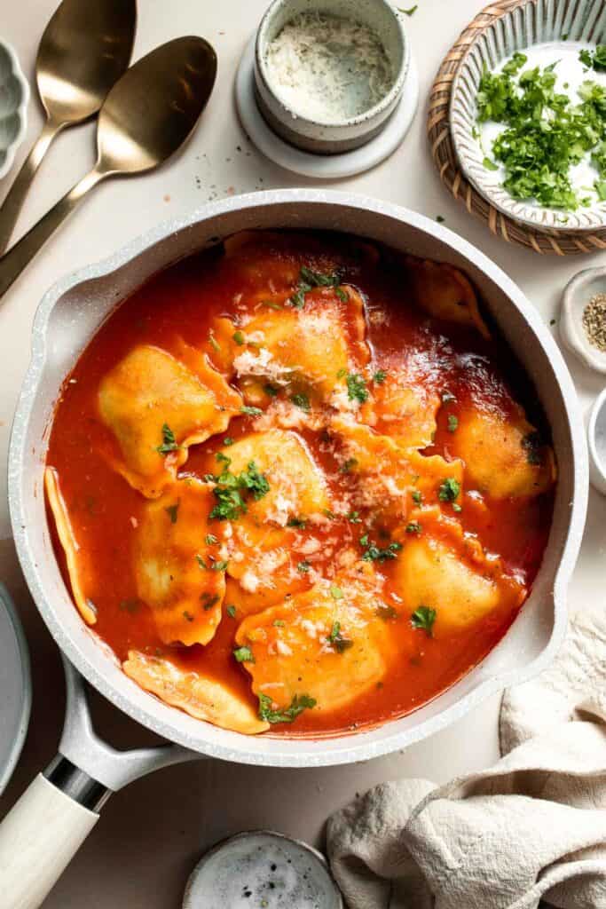 This simple Ravioli Soup is a quick, cozy meal with plump pillows of ravioli simmered in a hearty homemade tomato soup. Ready in just 20 minutes! | aheadofthyme.com