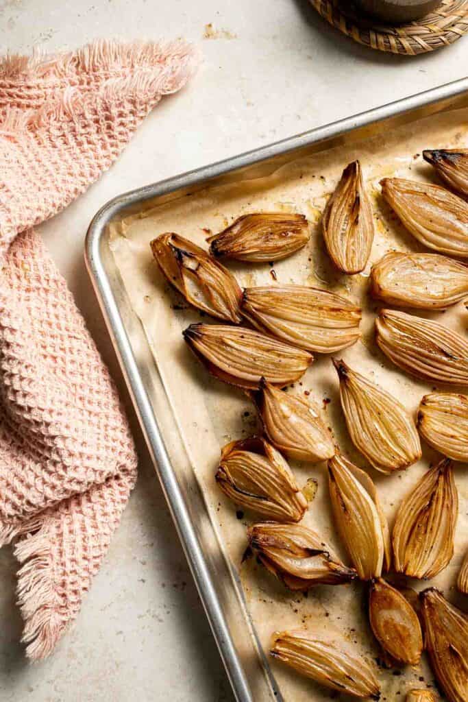 Roasted Shallots are a rich, caramelized side dish with a hint of sweetness and a kick from tangy balsamic vinegar. Ready in just 30 minutes! | aheadofthyme.com