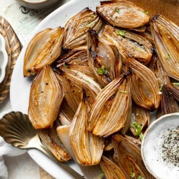 Roasted Shallots are a rich, caramelized side dish with a hint of sweetness and a kick from tangy balsamic vinegar. Ready in just 30 minutes! | aheadofthyme.com