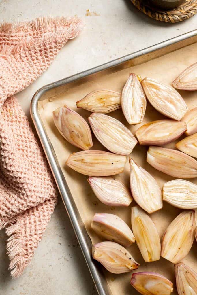 Roasted Shallots are a rich, caramelized side dish with a hint of sweetness and a kick from tangy balsamic vinegar. Ready in just 30 minutes! | aheadofthyme.com