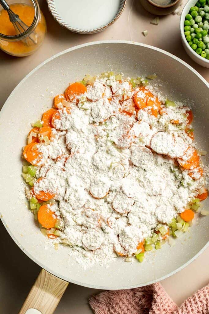 Vegetarian Pot Pie is truly the ultimate comfort food. The creamy filling is loaded with tender veggies, all wrapped in a buttery, flaky puff pastry crust. | aheadofthyme.com