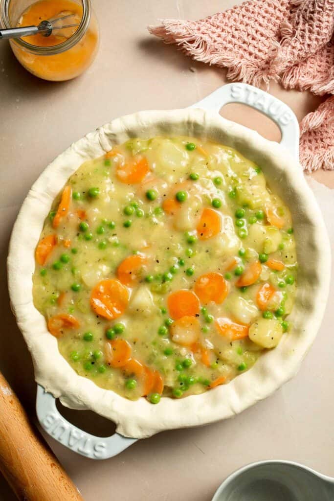 Vegetarian Pot Pie is truly the ultimate comfort food. The creamy filling is loaded with tender veggies, all wrapped in a buttery, flaky puff pastry crust. | aheadofthyme.com