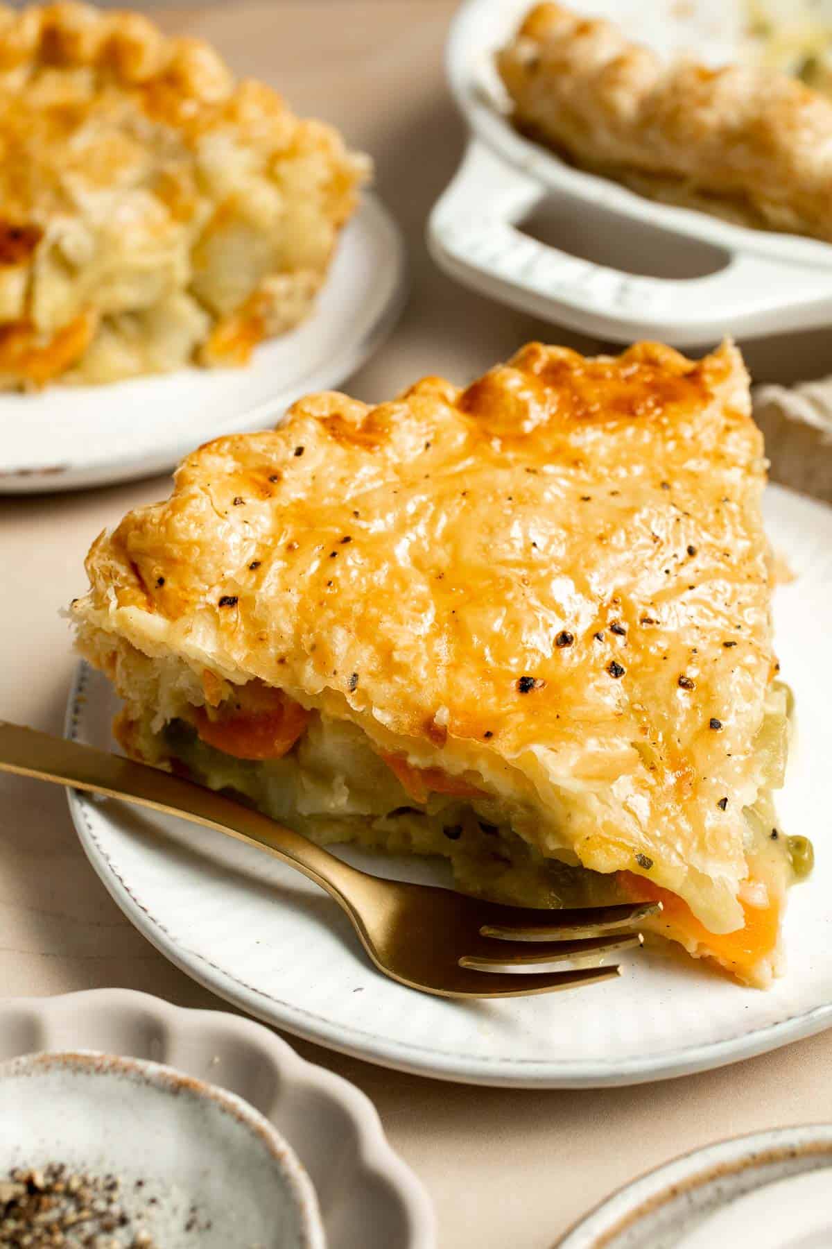 Vegetarian Pot Pie is truly the ultimate comfort food. The creamy filling is loaded with tender veggies, all wrapped in a buttery, flaky puff pastry crust. | aheadofthyme.com