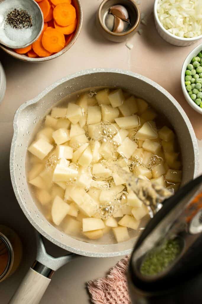 Vegetarian Pot Pie is truly the ultimate comfort food. The creamy filling is loaded with tender veggies, all wrapped in a buttery, flaky puff pastry crust. | aheadofthyme.com