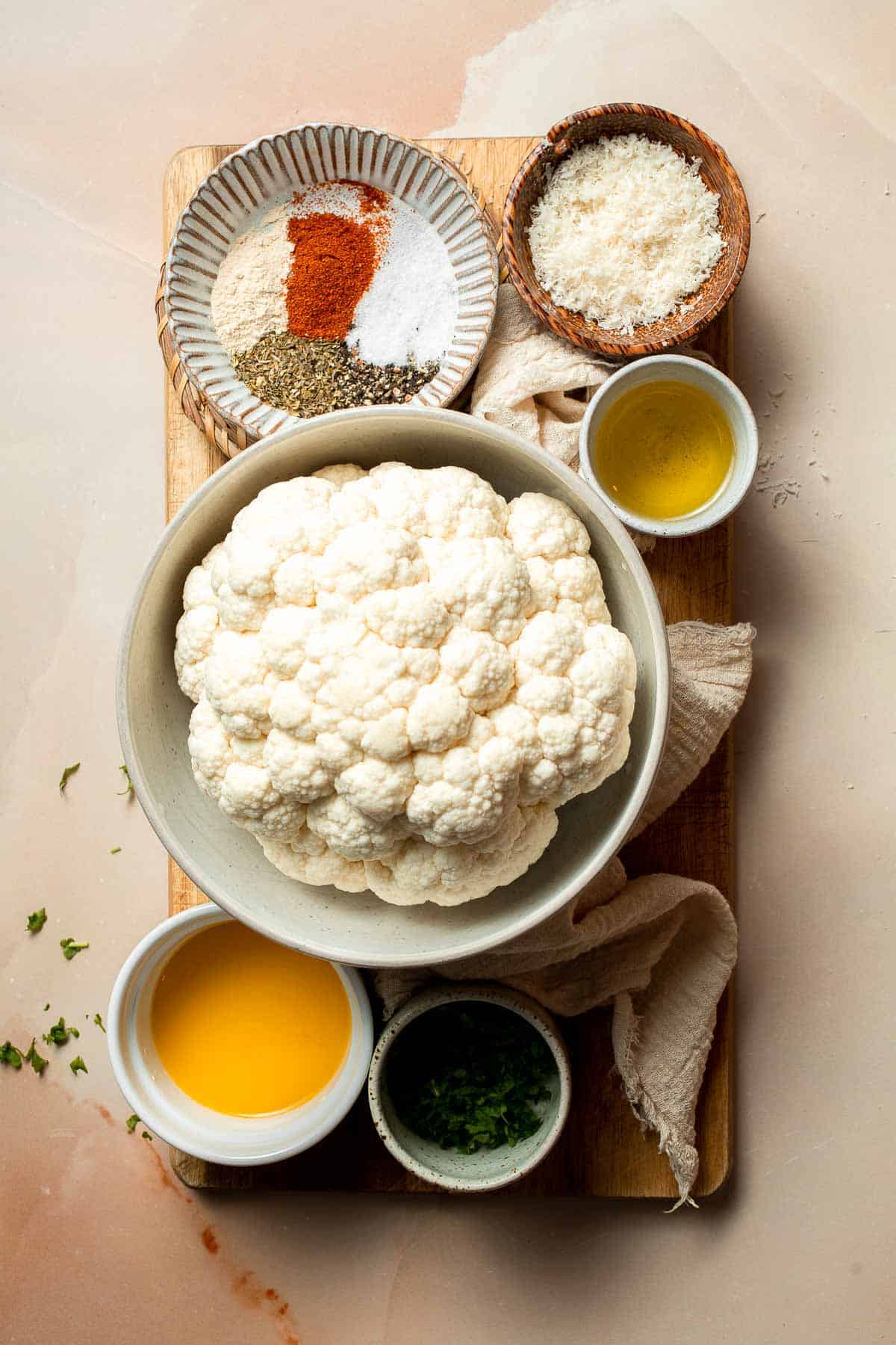 Whole Roasted Cauliflower features a flavorful crust and tender, buttery florets. It is a stunning vegetarian centerpiece that is easy to prepare. | aheadofthyme.com