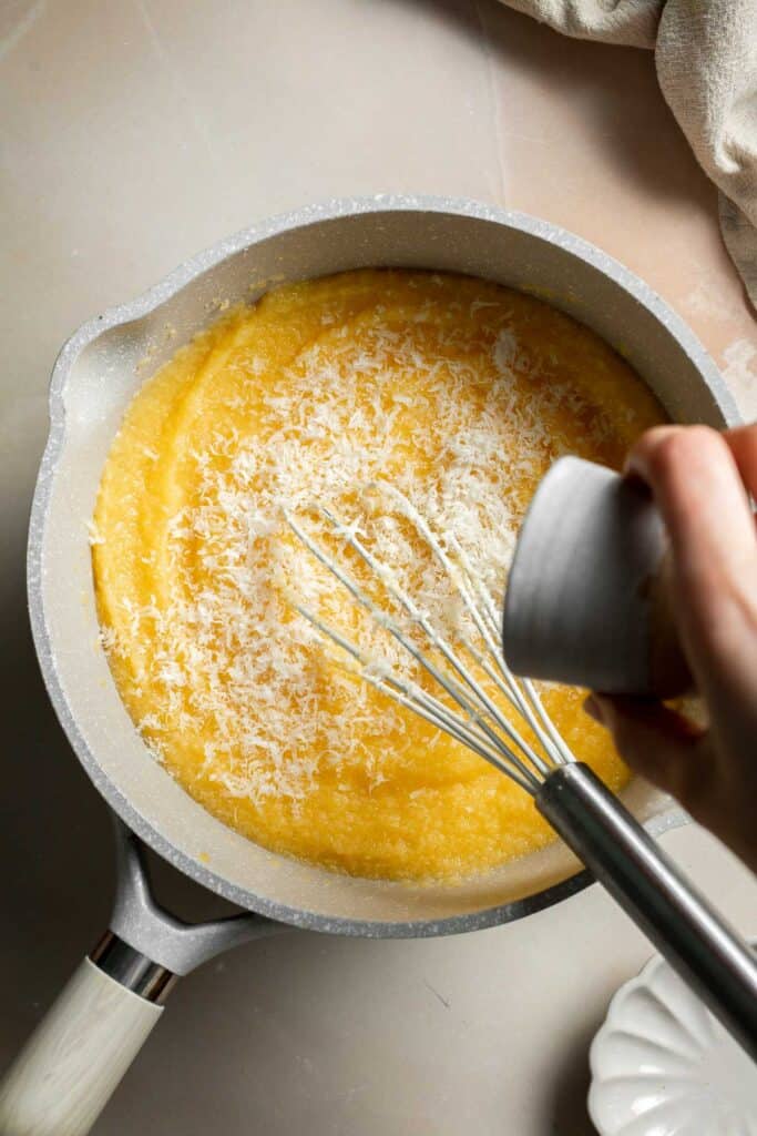 Creamy Polenta is simple, warm, and comforting side dish, made with a handful of simple ingredients and about 30 minutes of time. It's gluten-free too! | aheadofthyme.com