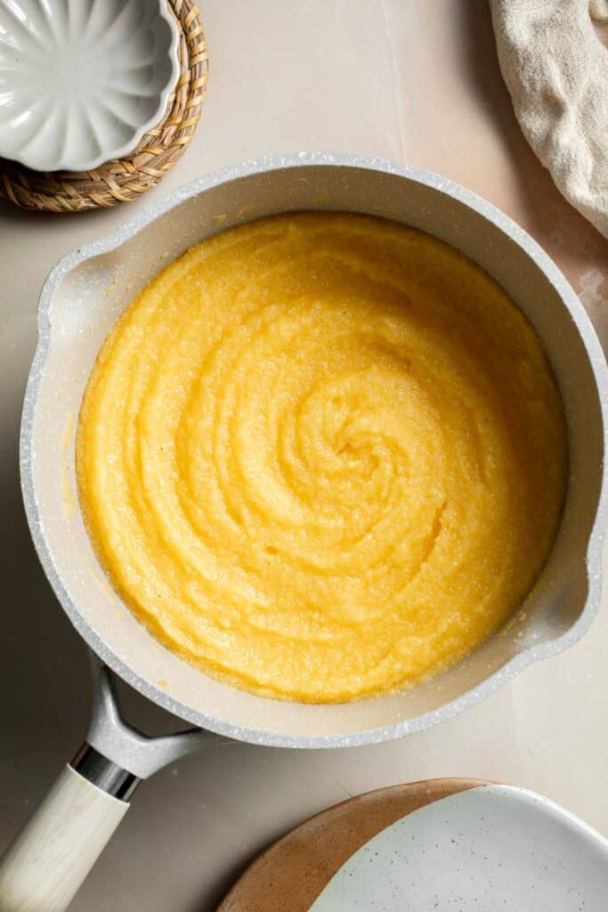 Creamy Polenta is simple, warm, and comforting side dish, made with a handful of simple ingredients and about 30 minutes of time. It's gluten-free too! | aheadofthyme.com