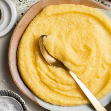 Creamy Polenta is simple, warm, and comforting side dish, made with a handful of simple ingredients and about 30 minutes of time. It's gluten-free too! | aheadofthyme.com