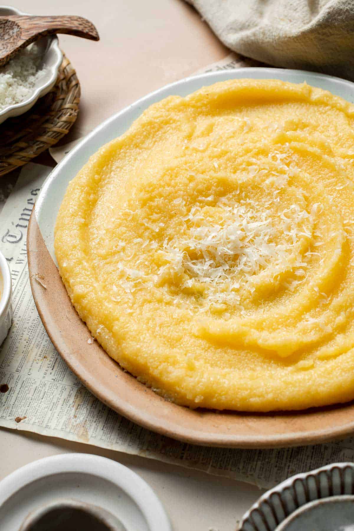 Creamy Polenta is simple, warm, and comforting side dish, made with a handful of simple ingredients and about 30 minutes of time. It's gluten-free too! | aheadofthyme.com