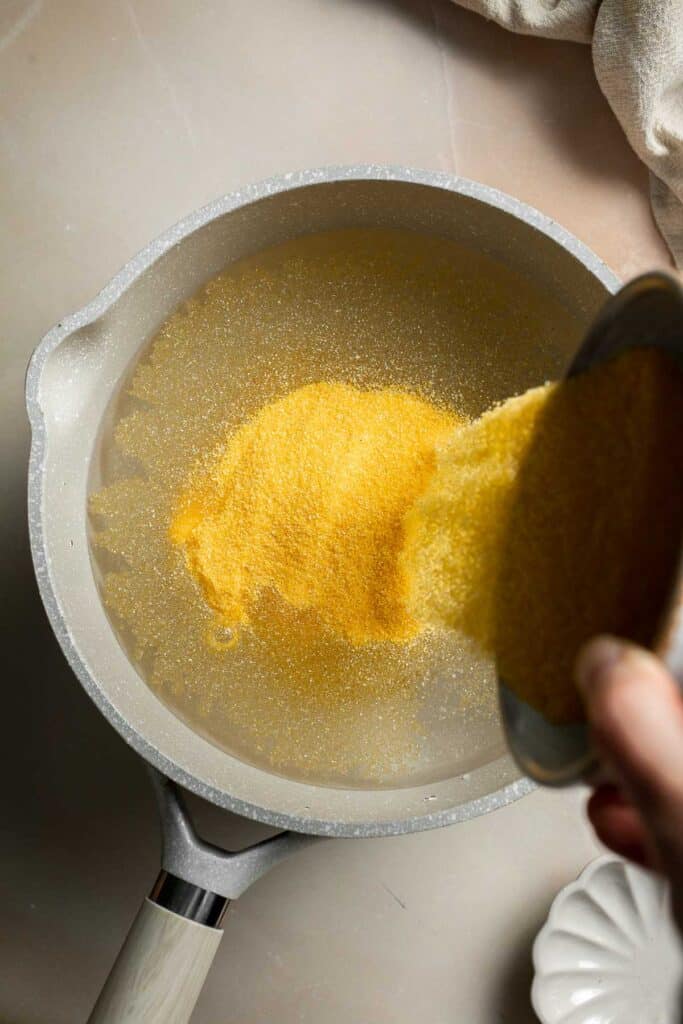 Creamy Polenta is simple, warm, and comforting side dish, made with a handful of simple ingredients and about 30 minutes of time. It's gluten-free too! | aheadofthyme.com
