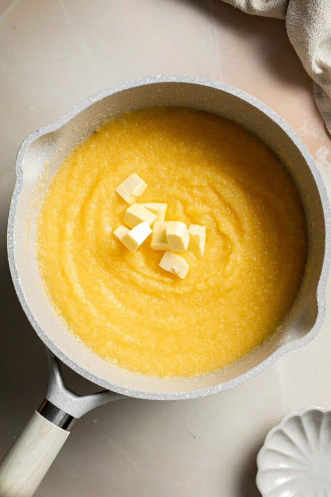 Creamy Polenta is simple, warm, and comforting side dish, made with a handful of simple ingredients and about 30 minutes of time. It's gluten-free too! | aheadofthyme.com