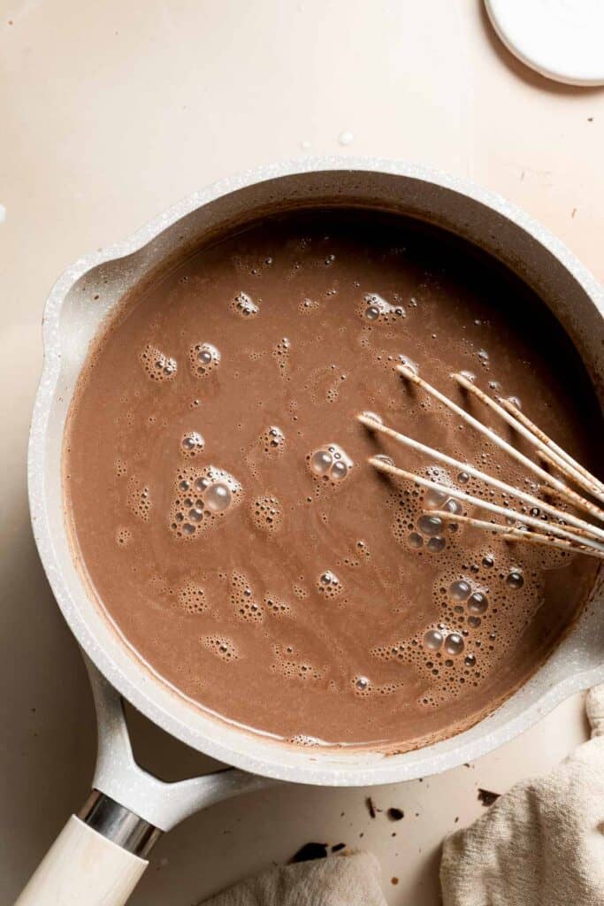 Homemade Hot Chocolate is made with actual chocolate, melted into milk, and whisked until smooth and creamy. No more prepackaged mixes! | aheadofthyme.com