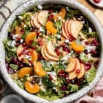 Festive Winter Pomegranate Salad is studded with sweet pomegranate seeds, apples, oranges, and feta, all tossed in a homemade balsamic vinaigrette. | aheadofthyme.com