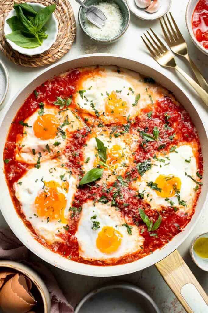 Eggs in Purgatory is made with perfectly poached eggs nestled in a rich, spicy tomato sauce, it’s a simple yet satisfying meal that’s ready in 25 minutes! | aheadofthyme.com