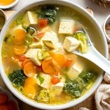 This homemade Tofu Soup is light and satisfying — with tender tofu cubes, vibrant veggies, and a savory broth for a deep, rich flavor that will warm you up. | aheadofthyme.com