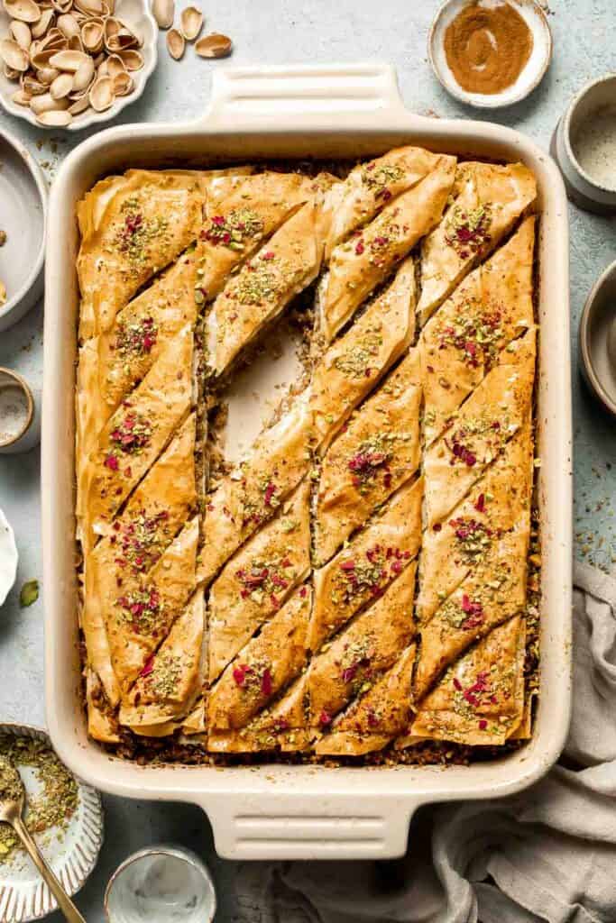 Persian Baklava is a crispy, flaky pastry layered with ground nuts, infused warm spices, and drenched in a fragrant rosewater and saffron honey syrup. | aheadofthyme.com