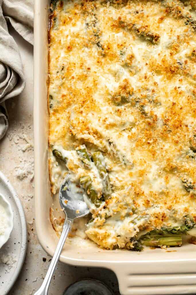 Asparagus Casserole is creamy and cheesy, featuring tender-crisp asparagus in a rich, garlicky sauce topped with a crispy panko and parmesan crust. | aheadofthyme.com