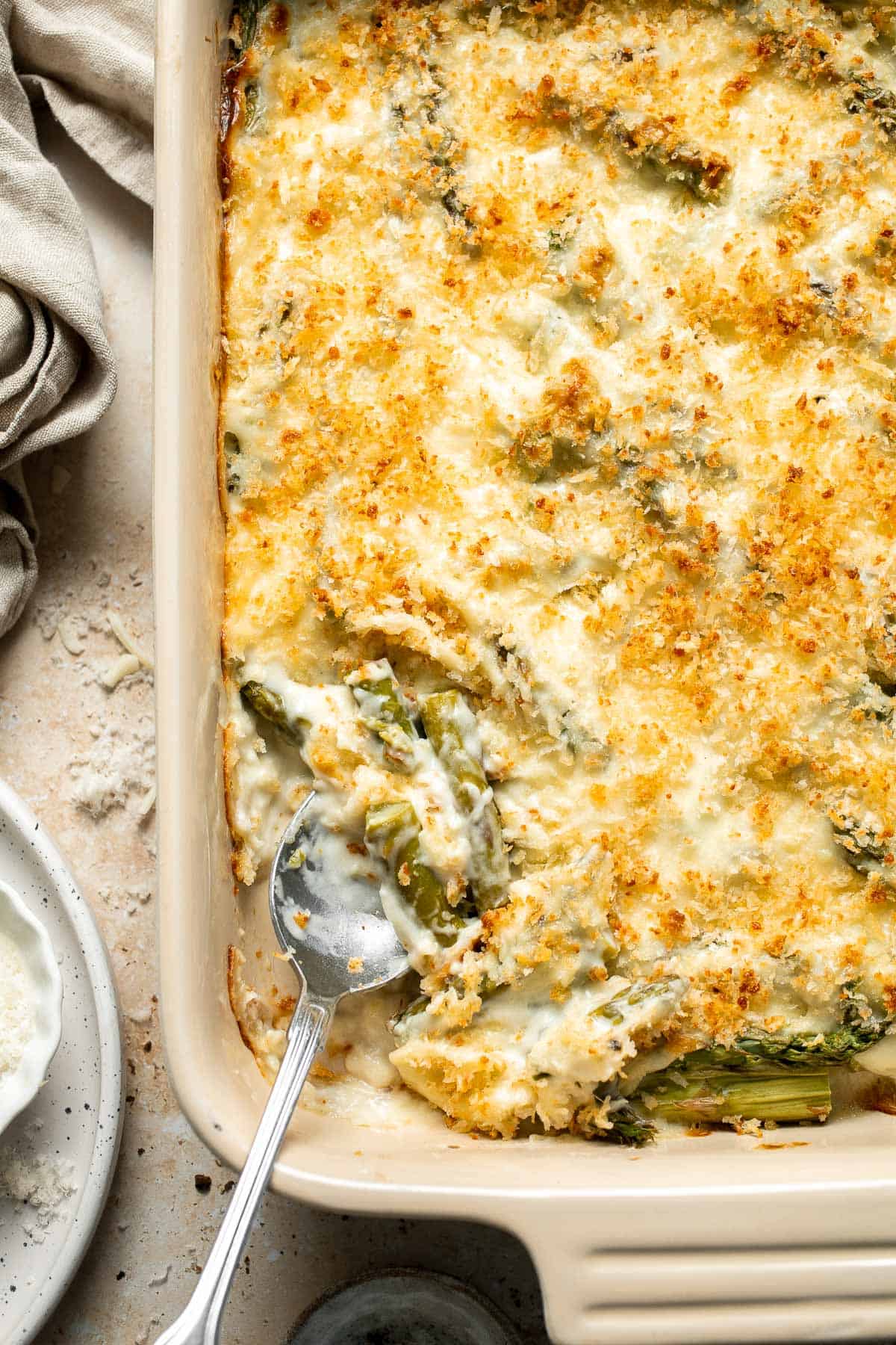 Asparagus Casserole is creamy and cheesy, featuring tender-crisp asparagus in a rich, garlicky sauce topped with a crispy panko and parmesan crust. | aheadofthyme.com
