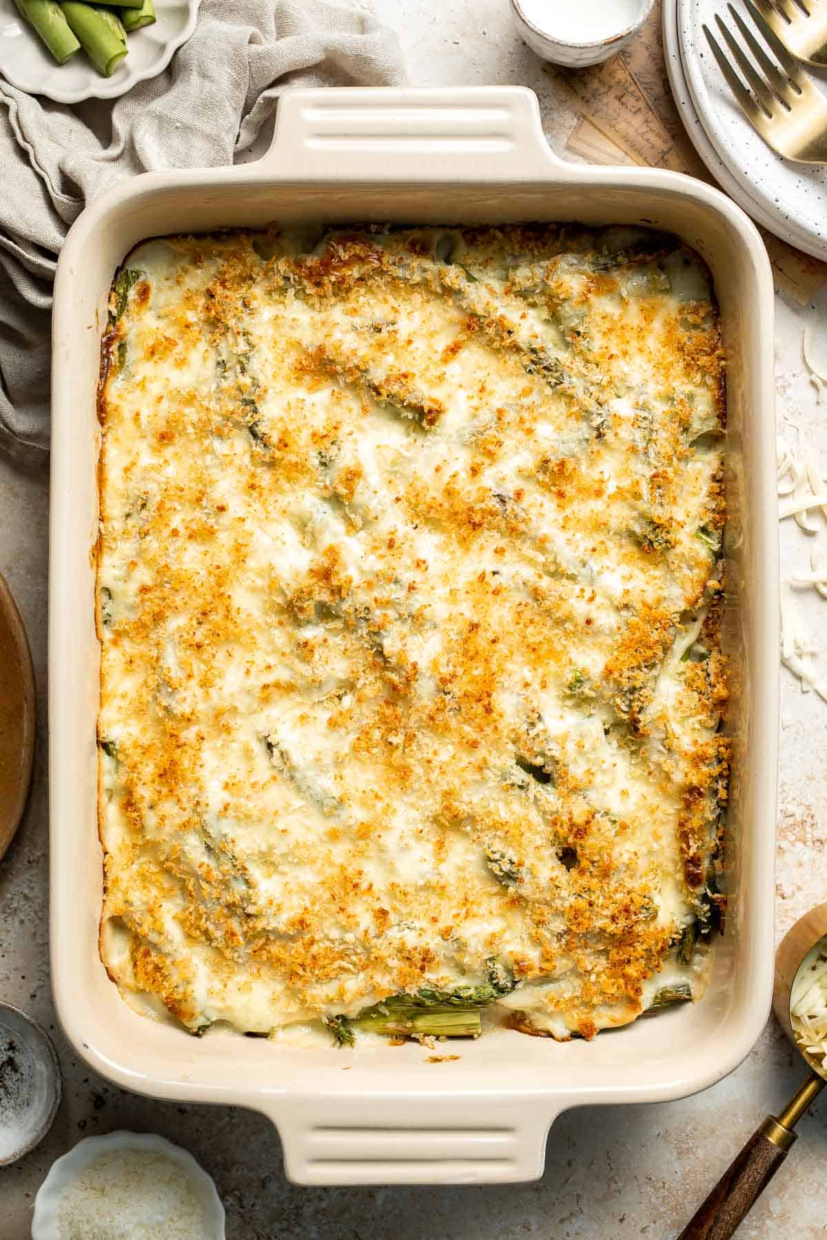 Asparagus Casserole is creamy and cheesy, featuring tender-crisp asparagus in a rich, garlicky sauce topped with a crispy panko and parmesan crust. | aheadofthyme.com