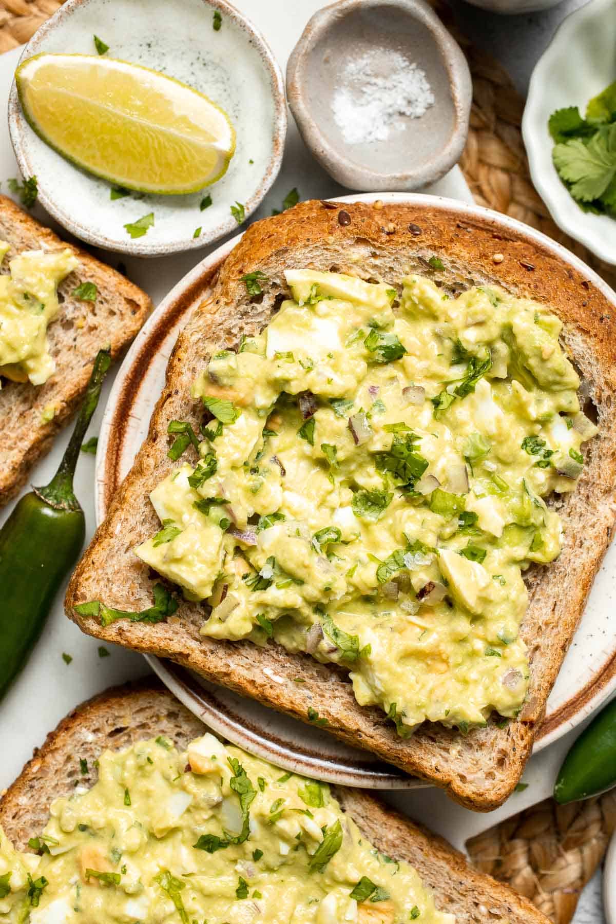 Avocado Egg Salad is a creamy, nutritious twist on the classic egg salad by adding avocado. Quick and easy to make as a sandwich, wrap, or on its own. | aheadofthyme.com