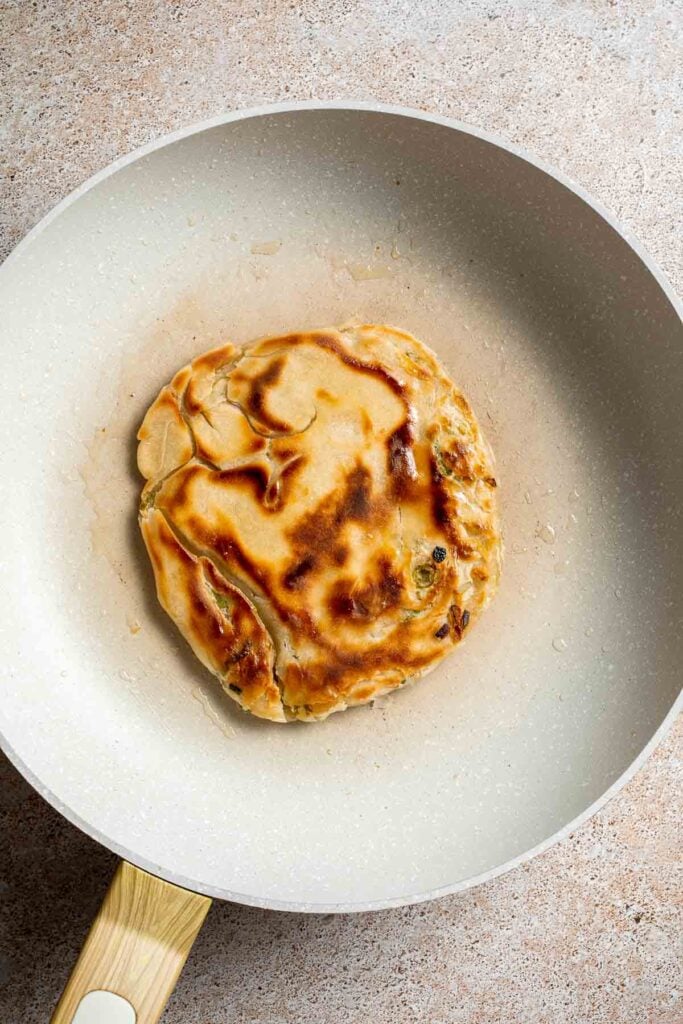 Chinese Scallion Pancakes are crispy, flaky, and packed with savory flavor in every bite. Better than takeout and surprisingly easy to make at home! | aheadofthyme.com